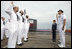 Mrs. Laura Bush observes a U.S. Navy Re-enlistment Ceremony Saturday, September 9, 2006, as Rear Admiral Fox, Director, White House Military Office, administers the oath to sailors prior to the Commissioning Ceremony of the USS Texas in Galveston, Texas. White House photo by Shealah Craighead 